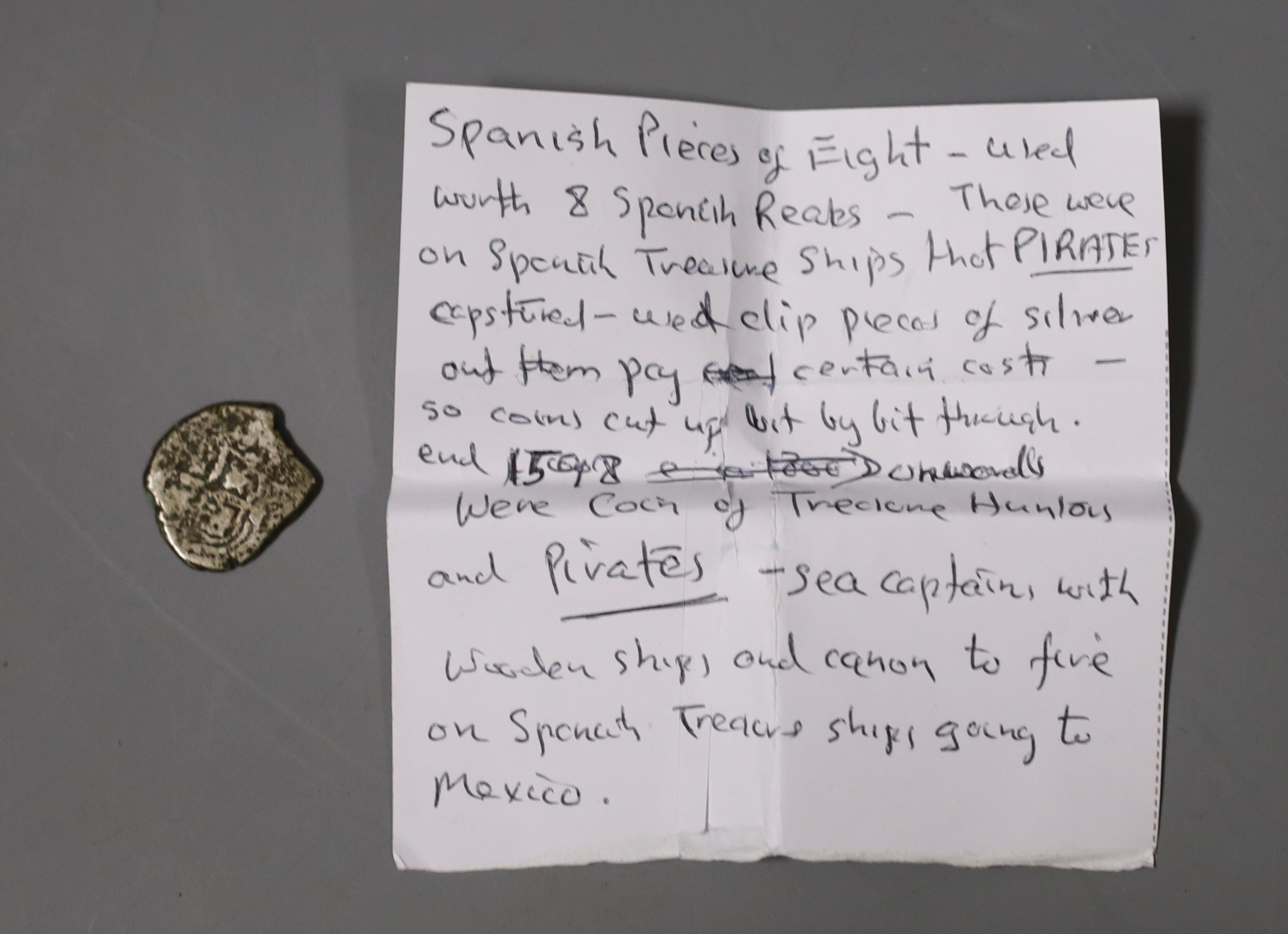 A modern Irish silver christening mug, Royal Irish Silver Co. Dublin, 1974, retailed by Asprey, London, 7cm, a late Victorian silver sovereign case, a gilt metal locket, part of a child's silver rattle and a polychrome e